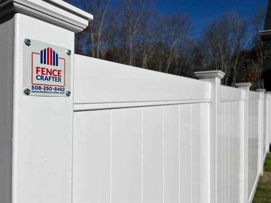 A close-up view of a white vinyl fence